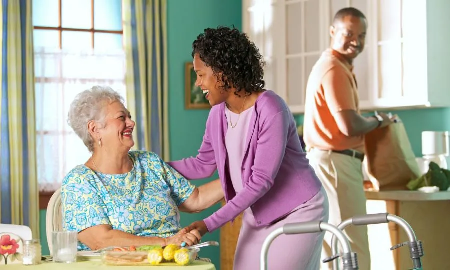A support worker visiting an older adult at home
